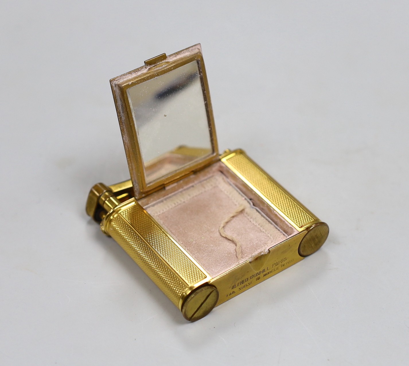 A gilt Dunhill compact / lipstick / cigarette lighter, 6cm with original box